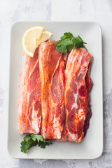 raw meat with herbs and garlic for grill on dish