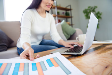 Cropped portrait of her she nice attractive lovely smart clever intelligent cheerful confident successful woman preparing finance presentation online in light white interior living-room indoors