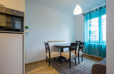 Kitchen interior with dining area in renovated apartment