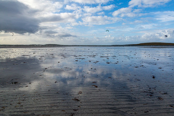 Reflections in the water at low tide, at Clachan Sands on the Island of North Uist