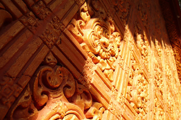 Golden bas relief in the walls of a Khmer Temple in Can Tho, Vietnam called Wat Khmer Munireangsey which is free and open to everyone