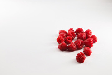 fresh raspberries on white background
