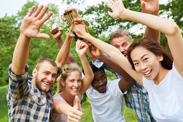 Multicultural team celebrates a victory