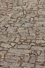 Granite cube, Overhead view of cobblestone street texture