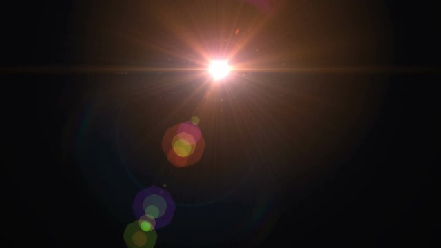 Lens flare light over black background. Easy to add overlay or screen filter over photos