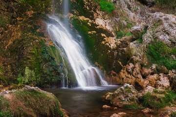 Beautiful waterfall in the village of Gostilje, close up. Nature outdoors travel destination Gostilje,  Zlatibor mountain, Serbia 
