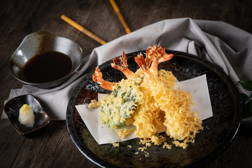 The tempura shrimps with sauce, deep-fried shrimps in the traditional Japanese restaurant.