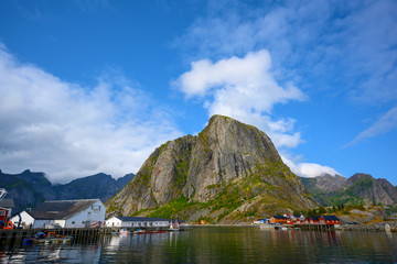 Blue skies with mountains and fishing villages at Hamnoy, Reine, Norway.