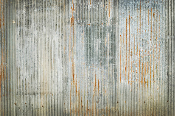 Old zinc wall texture background, rusty on galvanized metal panel sheeting.