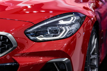 Obraz na płótnie Canvas car front red headlight new design