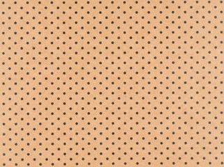 Brown craft paper with small black dots
