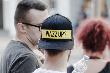 Wazz up sign on the  hat  