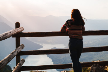 Woman in jeans at the lake Perucac mountain Tara