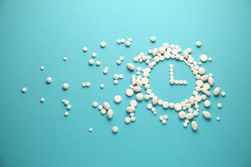 Hours of white tablets and pills, health. Rapid rate of action of drug.