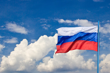 Russian national flag against the blue sky