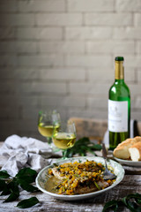 Fish under a vegetable marinade with wine.