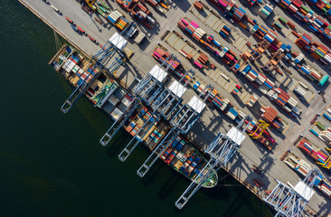 Aerial view container ship to sea port loading container for import export or transportation. shipping  business logistic. Trade Port and Shipping cargo to harbor, International transportation.