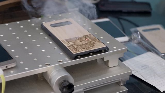 Laser engraving process of smartphone protection case.