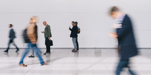 blurred business people at a trade fair