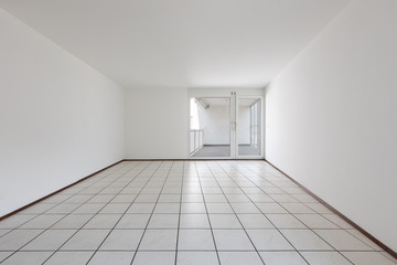 Obraz premium Front view of empty room with white walls and tiles