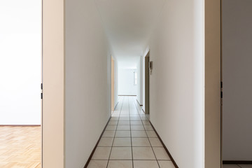White empty corridor with tile