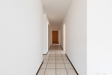 White empty corridor with tile