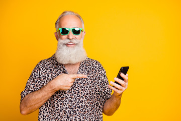 Portrait of funny funky old bearded hipster use point his cellphone find online sales discounts...
