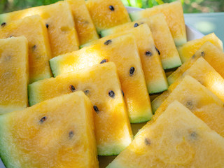 Closeup - Organic yellow watermelon triangles, vegetarian nutrition,healthy eating