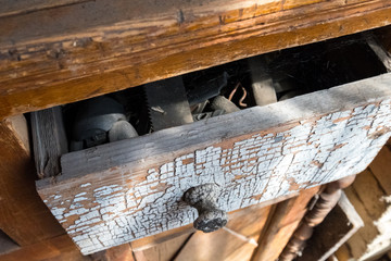 Ajar old toolbox. Wooden chest of drawers