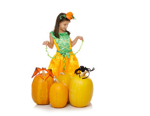 Cute little girl in pumpkin costume on white background. Happy Halloween!