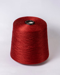 bobbin of yarn on a white background. Side view.Textile reel on isolated white background.
