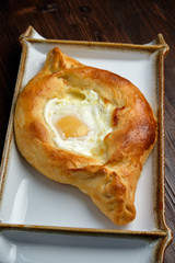 Khachapuri with egg in Adjarian. restaurant menu