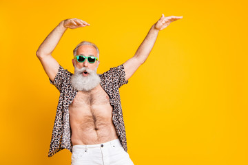 Photo of aged old man fooling still feeling young while isolated with yellow background