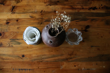 Top view of vintage 1920s themed table-top decoration on a wooden rustic table in a cafe