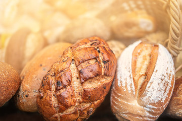 Different kinds of Freshly Baked  Bread, may use as background, top view.  Rustic loaves of bread close up. .