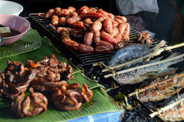 Authentic laotian street food sold in the famous Luang Prabang morning market in Laos