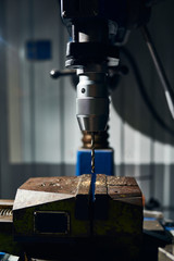 Drill in the chuck. Equipment for drilling holes. Close-up.