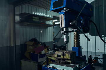 Equipment for drilling holes in a car service.