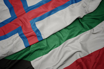 waving colorful flag of kuwait and national flag of faroe islands.