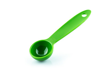 measuring spoon of plastic on white background.