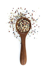 quinoa in spoon on white background.