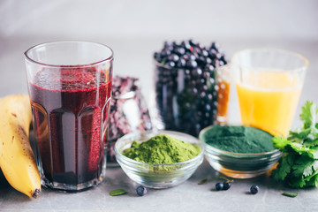 Fresh blueberries, bilberry, barley grass juice, spirulina, orange juice, dulse and cilantro on...
