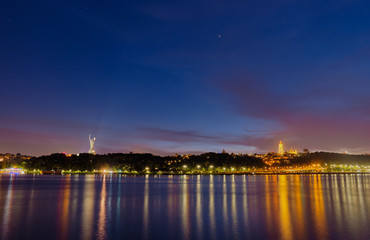 The Motherland Monument and Kyiv Pechersk Lavra in Kyiv at night.