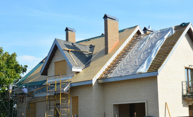 Roofing Contractors Installing House Roof Asphalt Shingles. Roofing Contractor Repair Roofing...