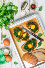 Baked spinach and egg sandwiches. Delicious and healthy Breakfast for gourmets. Selective focus