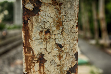 Railroad and Metal rust on guide post background