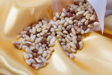 Dry Organic Pine Nuts on a Background