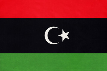 Libya national fabric flag textile background. Symbol of international world African country. - obrazy, fototapety, plakaty