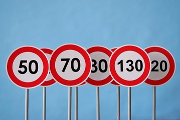 A road signs indicating a speed limit. Traffic signs on a blue background