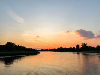 Beautiful summer sunset on the Dnipro river. Kherson, Ukraine. Landscape